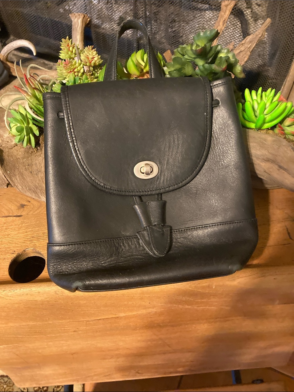Coach Black Leather Turn-Lock Backpack 9.5x7x5”.